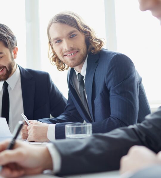 Portrait of positive managers at meeting