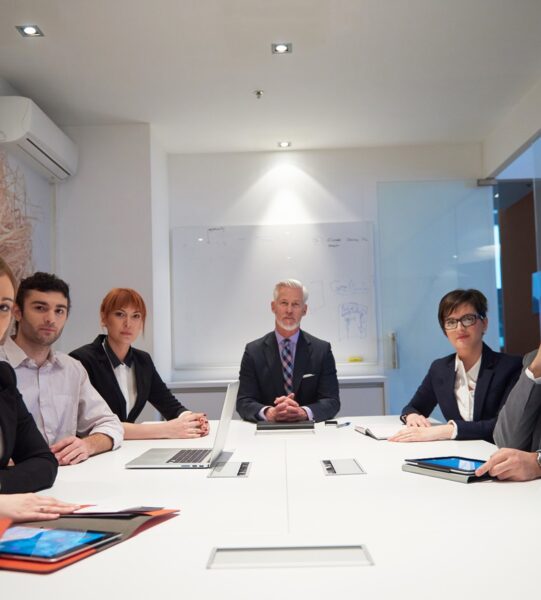 business people group with young adults and senior on meeting at modern bright office interior.